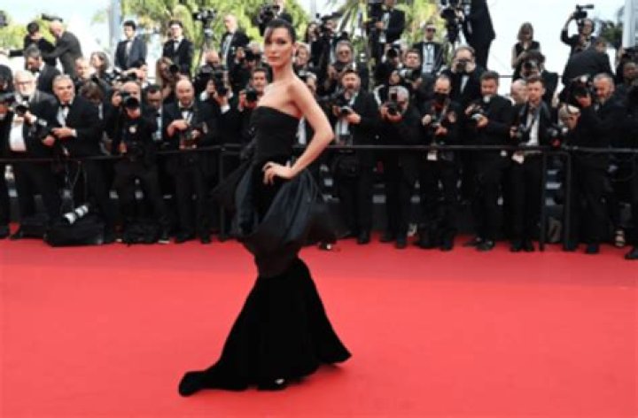 Bella Hadid, in an open vintage Versace dress, appeared on the red carpet of Cannes
