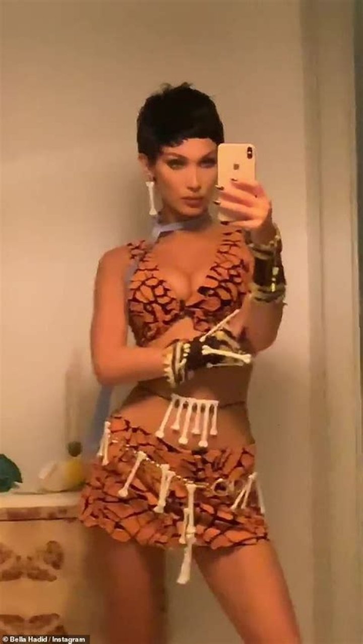 Bella Hadid Is Fred Flintstone For Halloween But Everyone’s Calling Her Halle Berry’s Character Sharon Stone