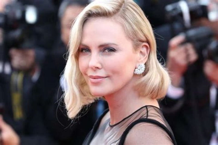 Charlize Theron Posts Photo Of Daughter Jackson In Red Dress During Vacation — The Reactions Took An Unexpected Turn
