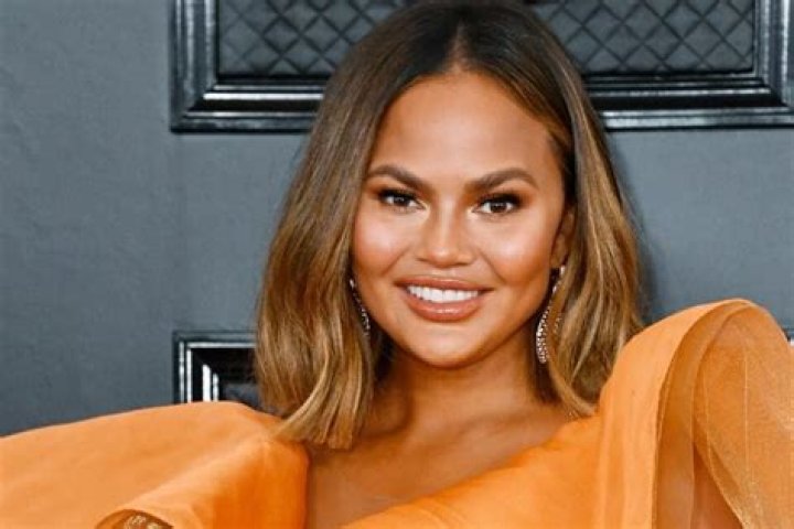 Chrissy Teigen Insists Her Massively Swollen Lips Are A Result Of Biting Into An Orange And NOT Lip Injections!