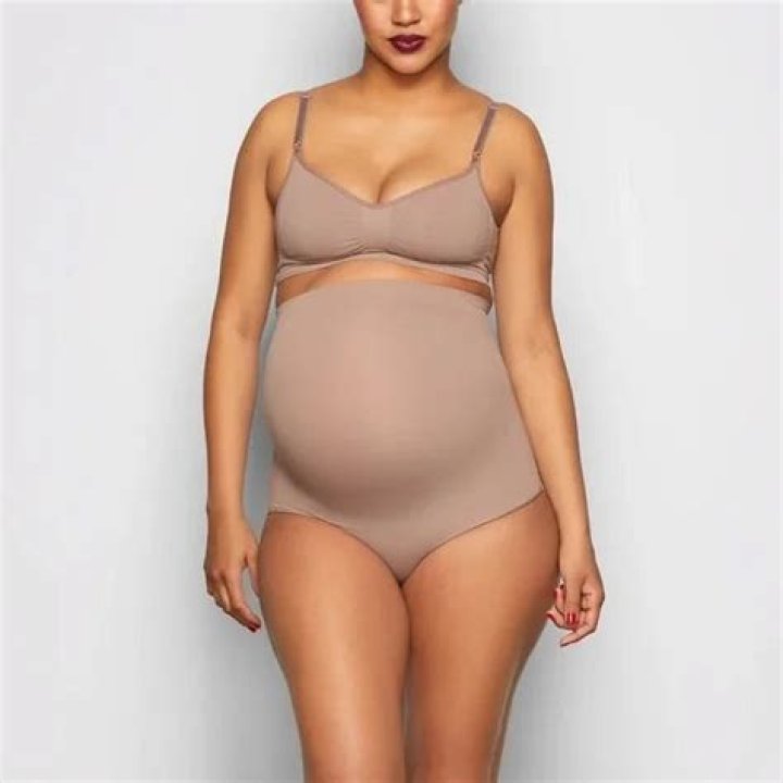 Chrissy Teigen Poses In Kim Kardashian’s Controversial Skims Maternity Shapewear