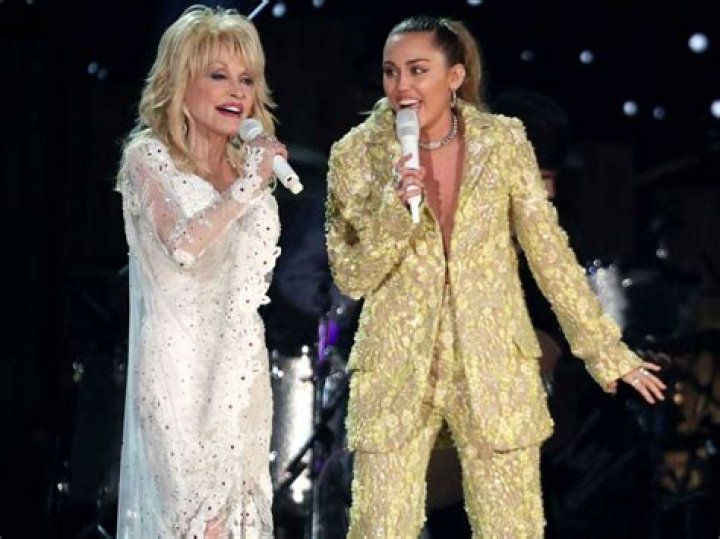 Dolly Parton Recalls The Moment She Agreed To Be Miley Cyrus’ Godmother