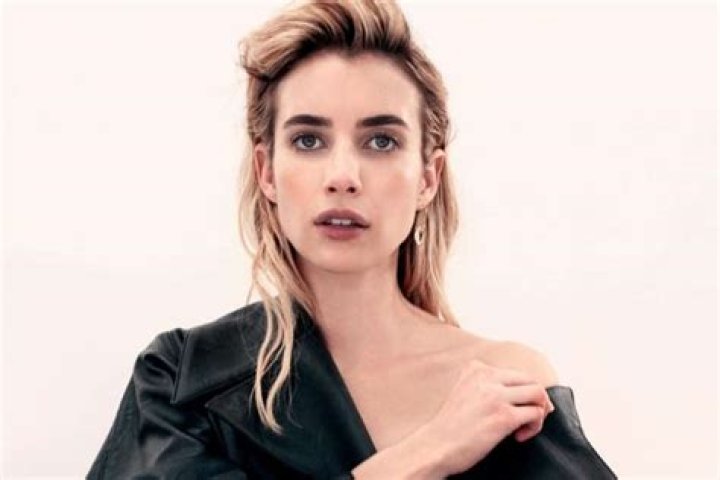 Emma Roberts Shows Off Burgeoning Baby Bump In Black Mini Dress