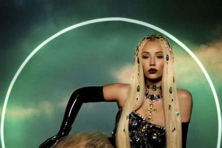 Iggy Azalea Stuns In New Vid Showing Off Her Glam Makeup And Blonde Hair While In Nothing But A White Robe