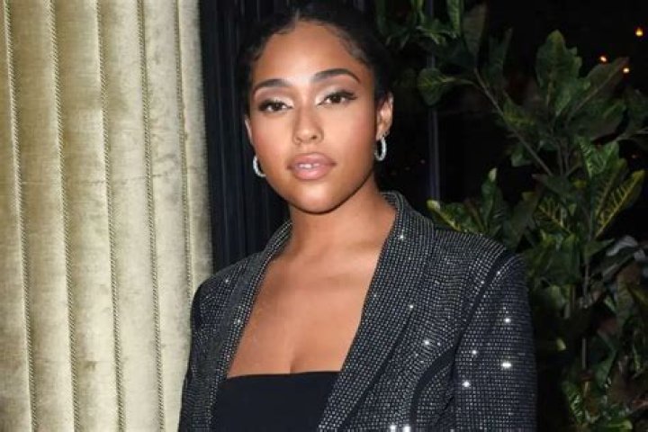 Jordyn Woods Rocks Her Curves In This Pink Skin-Tight Dress – Fans Ask For A Beauty Line