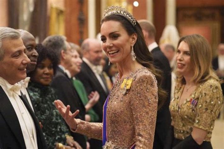 Kate Middleton, in a mint green dress, surprised the audience at a summer reception at Buckingham Palace