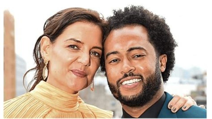 Katie Holmes, in a flowing peach-colored dress for the first time, came out with a new boyfriend