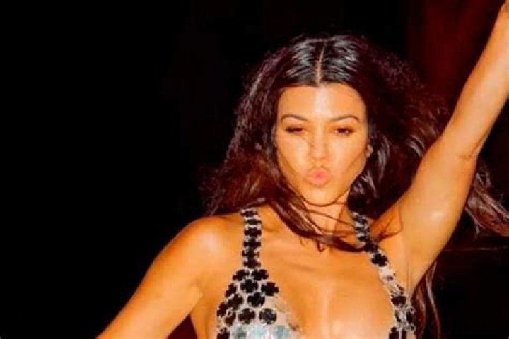 Kourtney Kardashian Shows Off Her Stunning Figure In Plunging Mini Dress