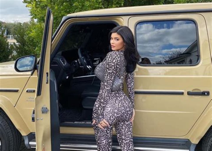 Kylie Jenner Shows Off Fabulous Curves While Posing Next To Her Mercedes-Benz SUV
