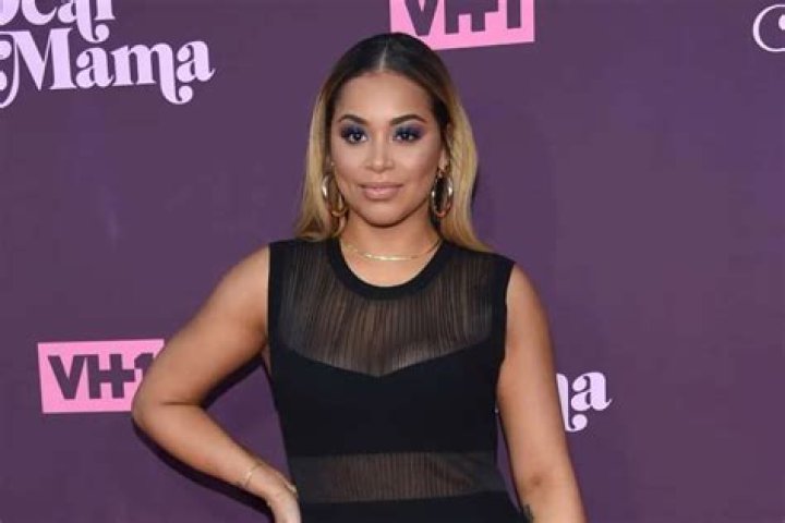 Lauren London Shares Never-Before-Seen Photo Where Nipsey Hussle Is Securing His Queen — Rain Or Shine He Was A Great Man