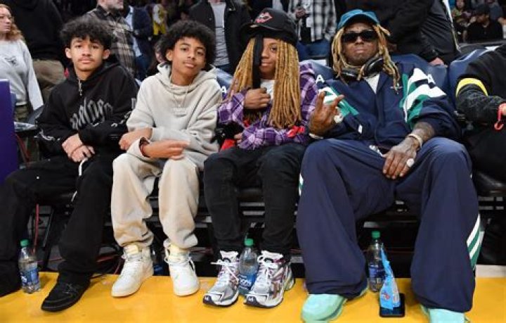 Lil Wayne’s Daughter, Reginae Carter, Shares Video Of Rapper Killing It On Stage And Calls Out Her Little Brothers, Neal Carter And Dwayne Carter III, For Not Doing Their Jobs