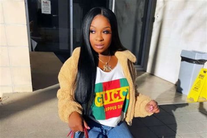 Reginae Carter Wishes A Happy Birthday To Robert Rushing, And All Fans See Is Her Bold Look In The Family Photo