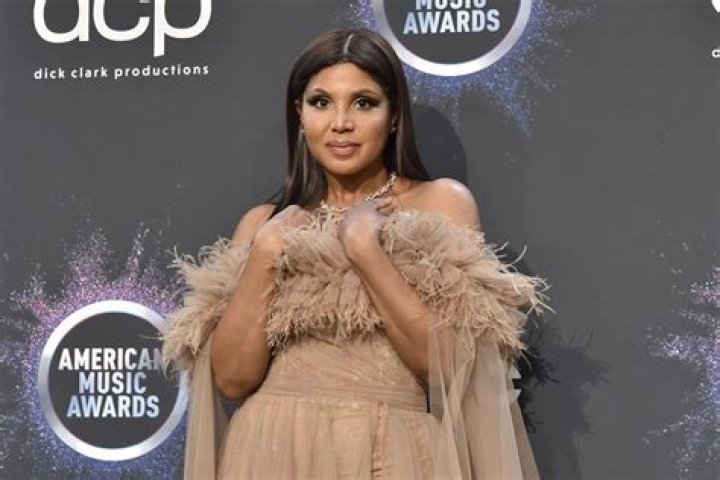 Toni Braxton Has Fans Drooling With This Photo – Check Out Her Red Revealing Dress!